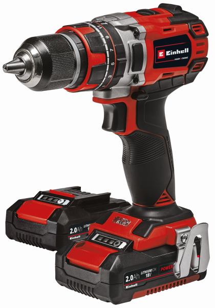 Red and black cordless drill with two batteries on a white background