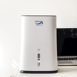 Image of a Crystal Aire Compact 2L Dehumidifier (600ml/day) w/ Automatic Timer & More out of packaging