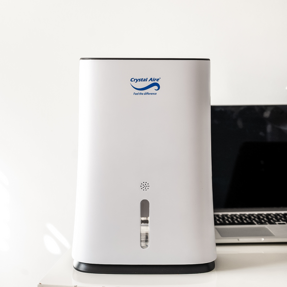 Image of a Crystal Aire Compact 2L Dehumidifier (600ml/day) w/ Automatic Timer & More out of packaging