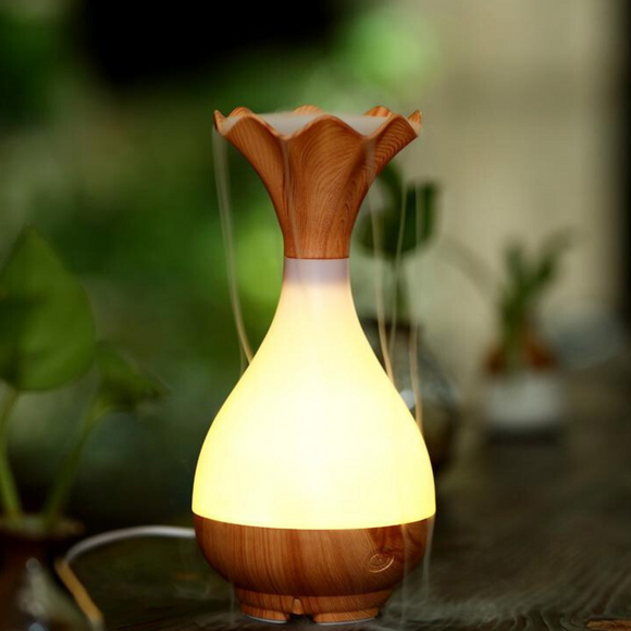 Image of a Crystal Aire Light Wood Flower Essential Oil Aroma Diffuser out of packaging