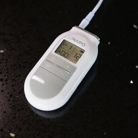 Image of a Naipo Tens Electronic Pulse Massager with 4 Electronic Pads & 5 Modes out of packaging