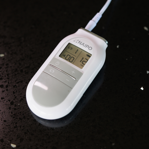 Image of a Naipo Tens Electronic Pulse Massager with 4 Electronic Pads & 5 Modes out of packaging