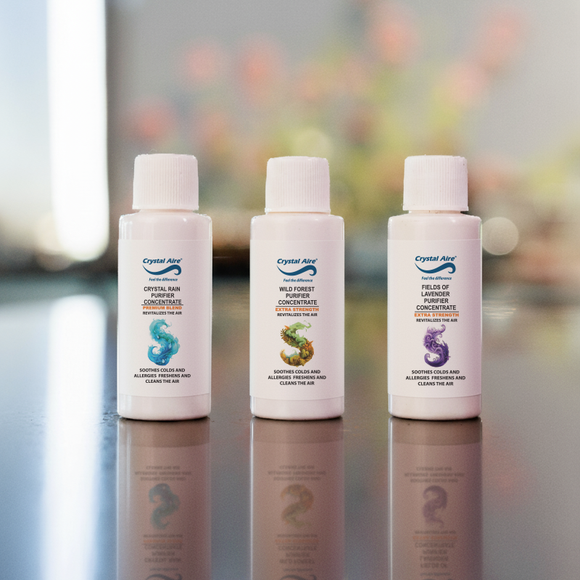 Image of a Crystal Aire 30ml Crystal Rain, Lavendar & Wild Forest Air Purifier Concentrates 3 Pack out of packaging
